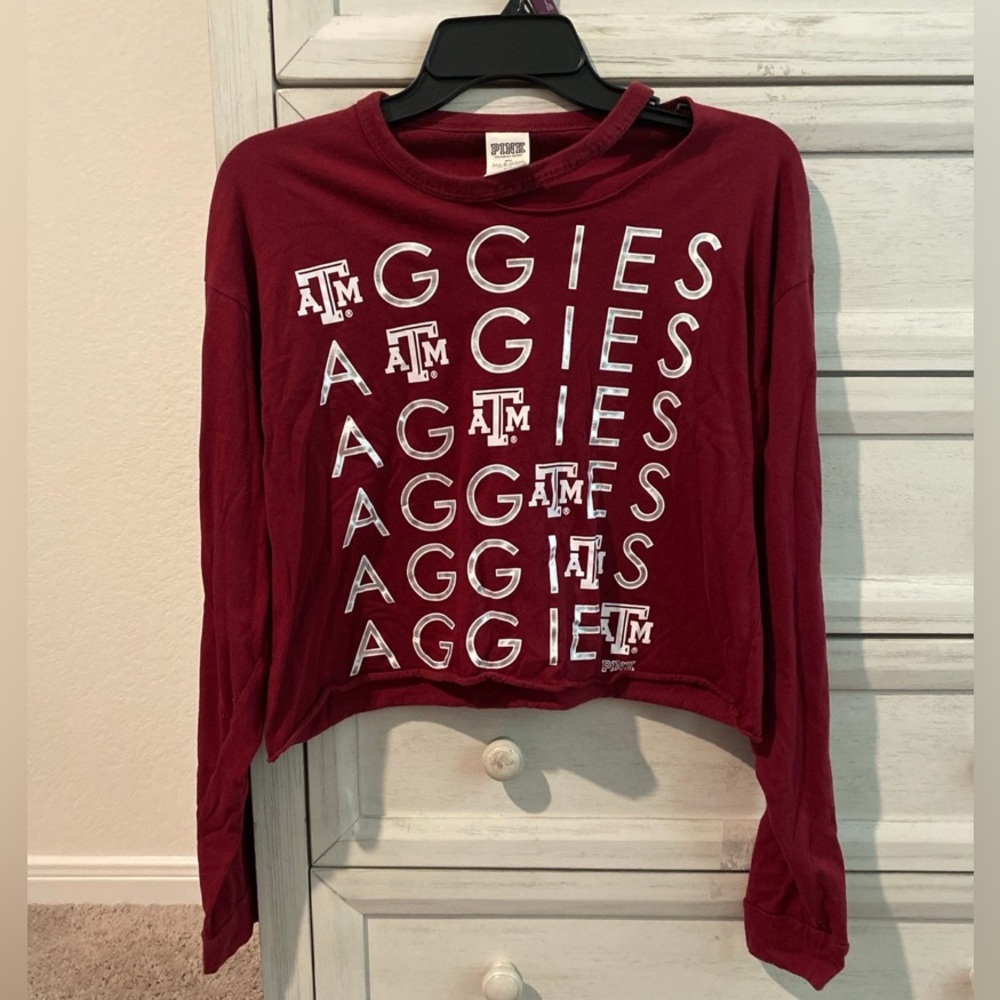 2 Texas A&M Aggies size M shirts in used condition.